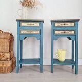 Blue wooden bedside tables with floral patterns