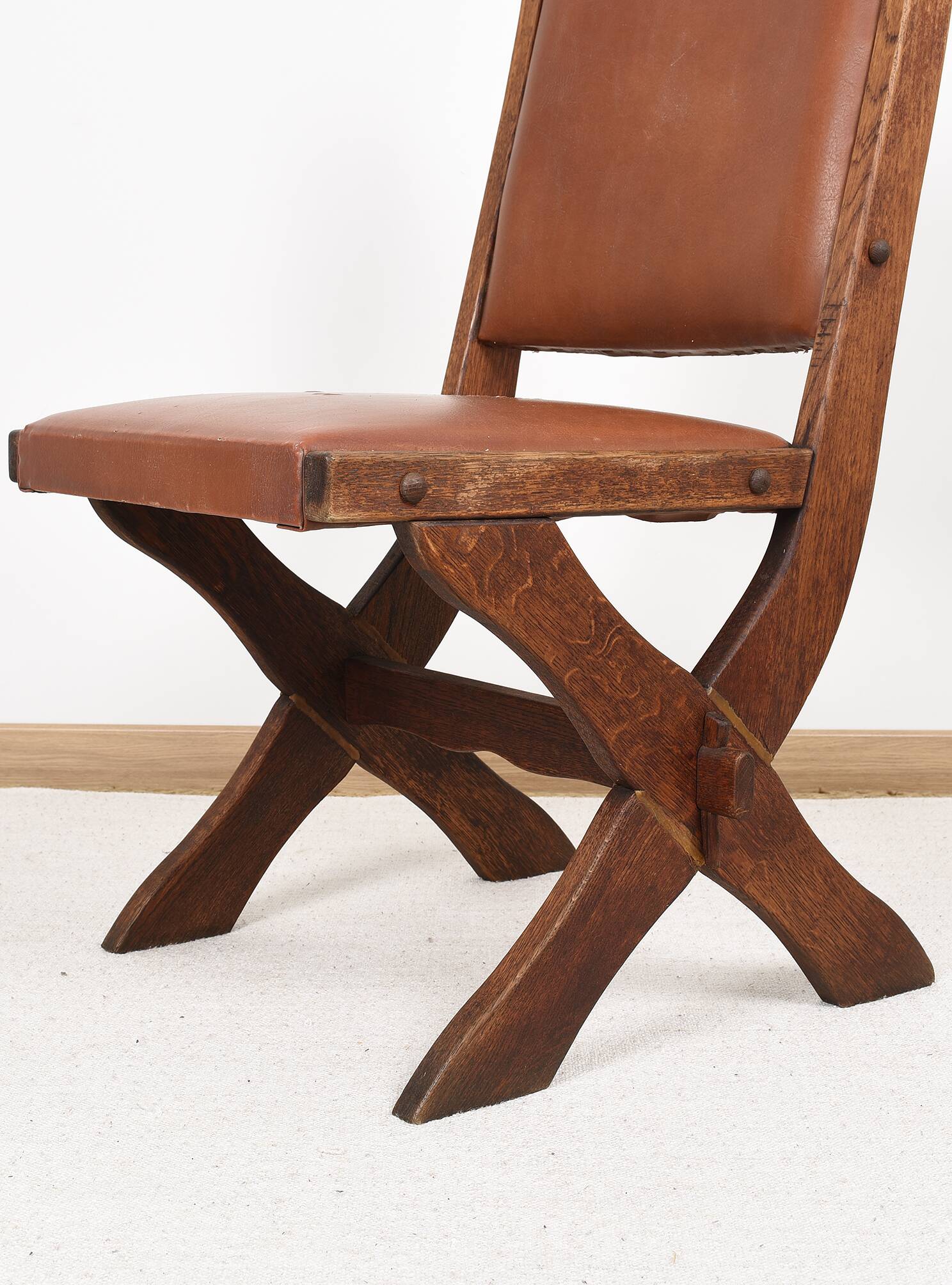 Pair of brutalist style chairs, in wood and leather.