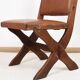 Pair of brutalist style chairs, in wood and leather.