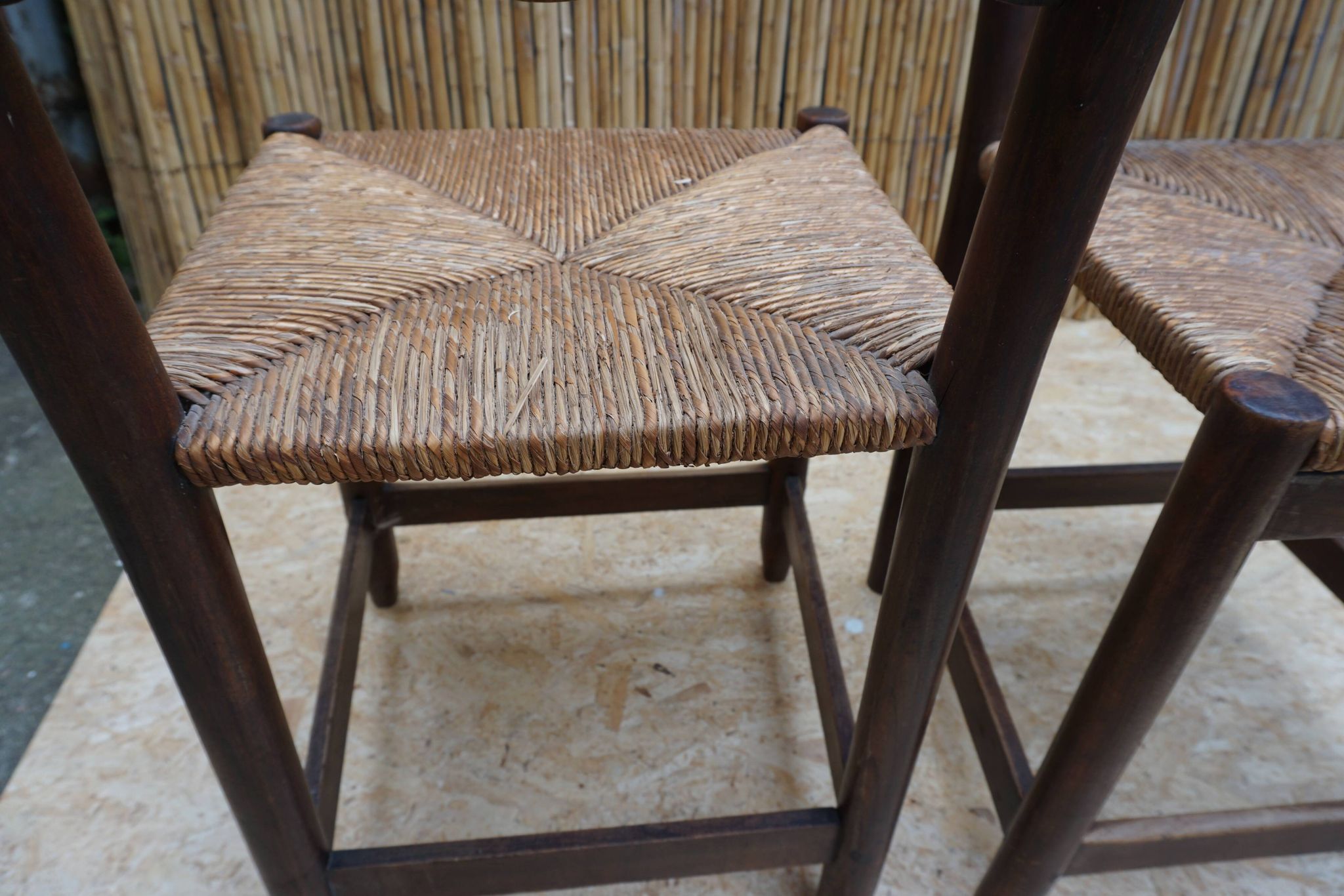 Pair of antique straw-seated farm chairs