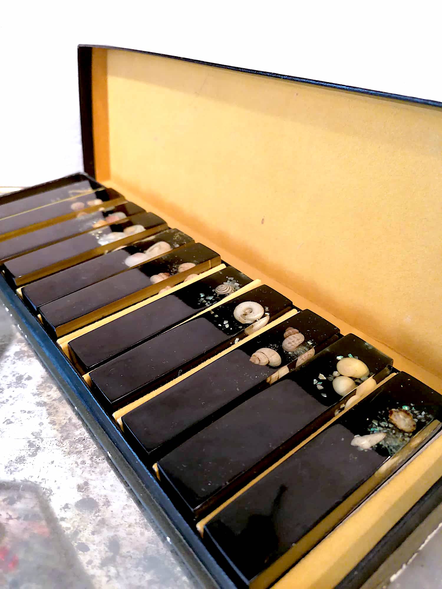 Set of 11 blackened resin knife holders, 1970s