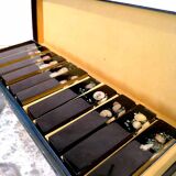 Set of 11 blackened resin knife holders, 1970s