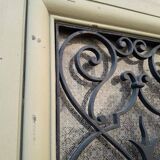 Porte d'entrée cintrée double en chêne, grilles et verre, XIXème