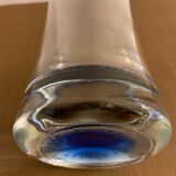 Glass roller vase with blue bubble background