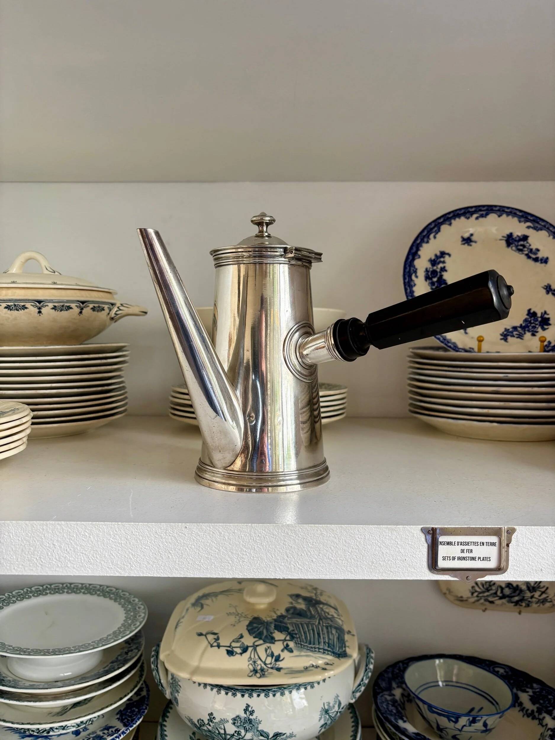 Christofle silver-plated chocolate pot and coffee pot with a blackened wooden handle.