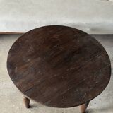 Coffee table, round antique Indonesian teak table with straight legs.
