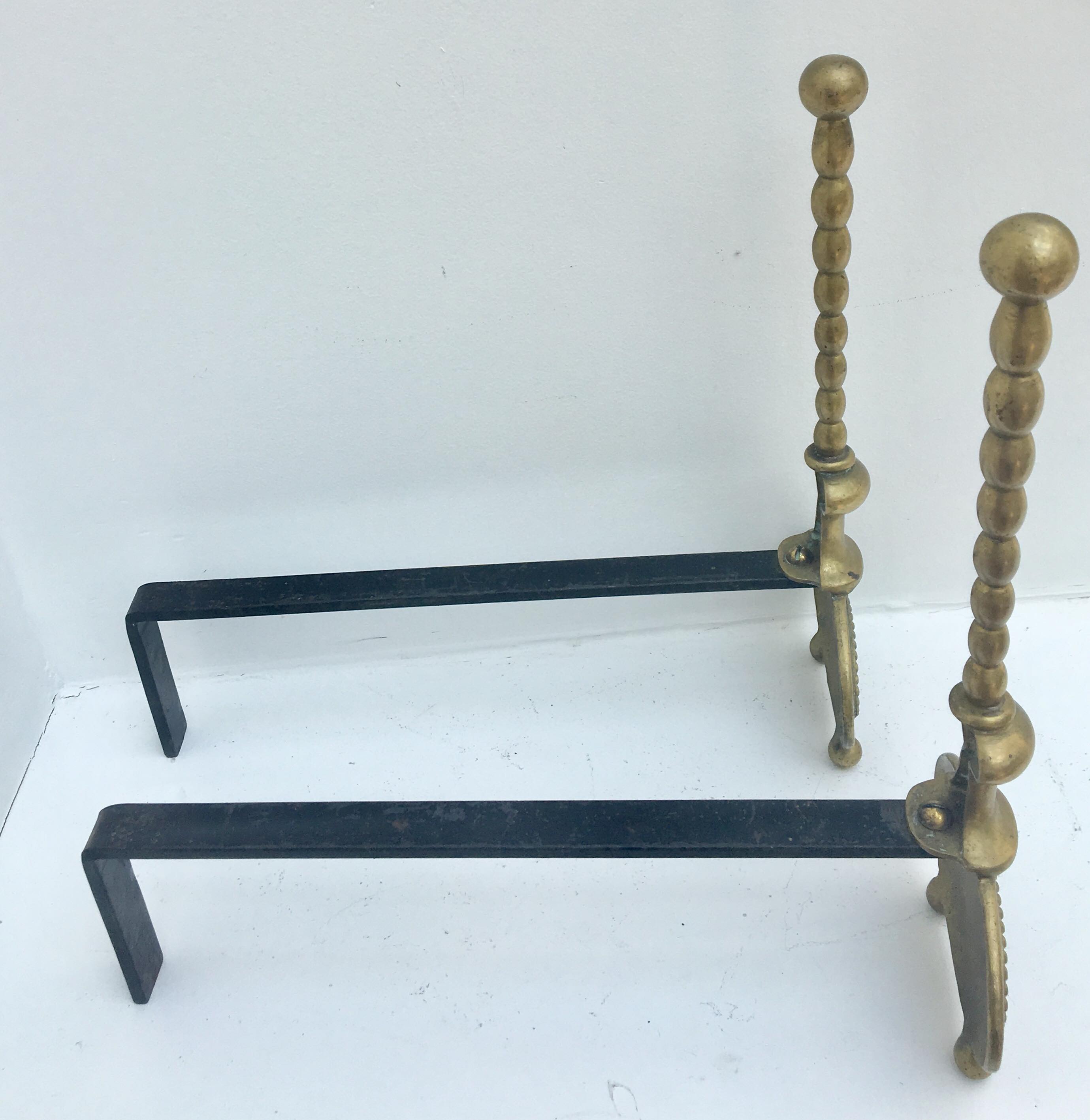 Pair of andirons in brass for fireplace