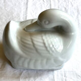 Porcelain duck dish with lid on fire
