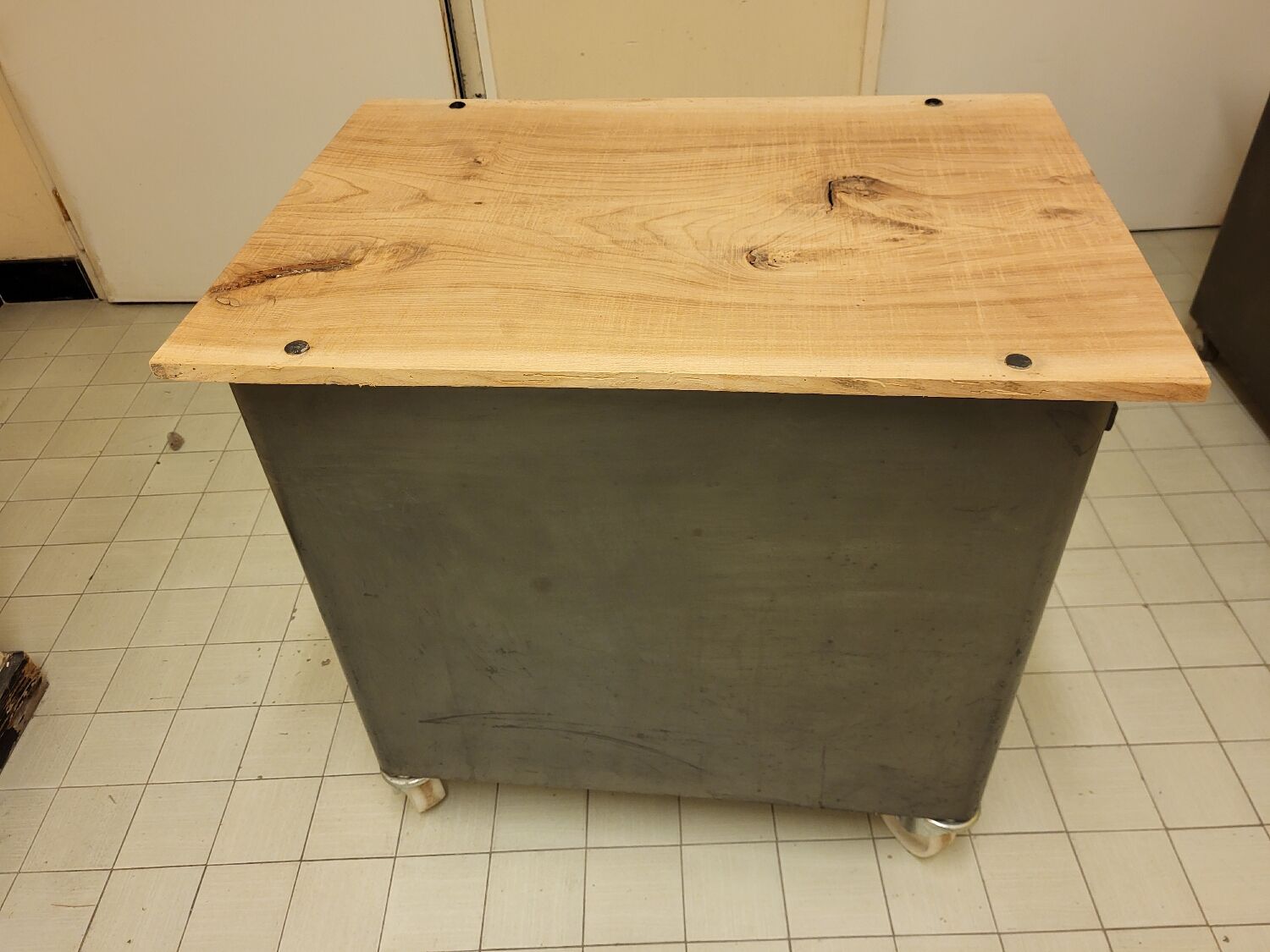 Wood and waxed metal furniture on casters