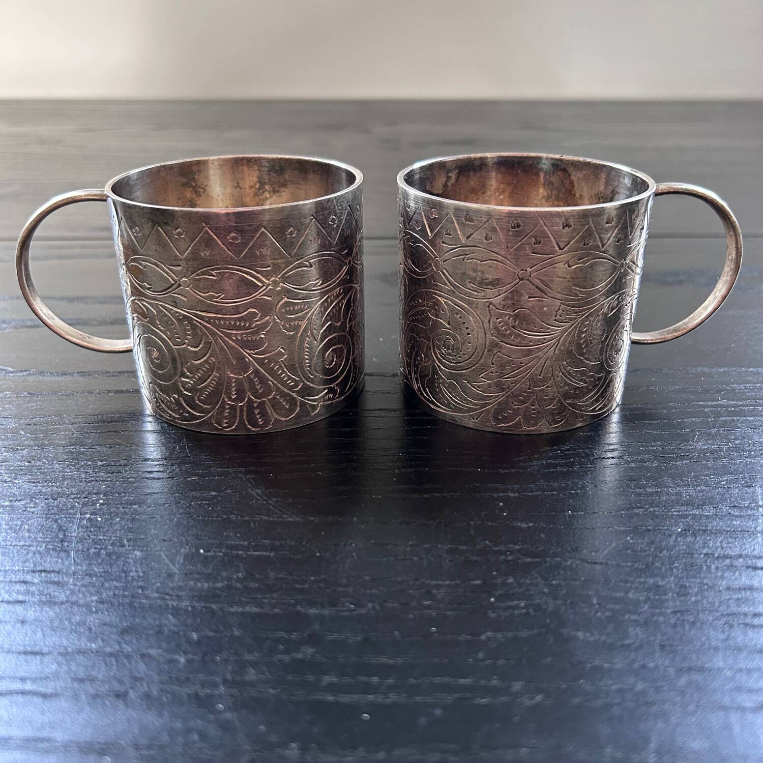 Pair of chiseled silver cups