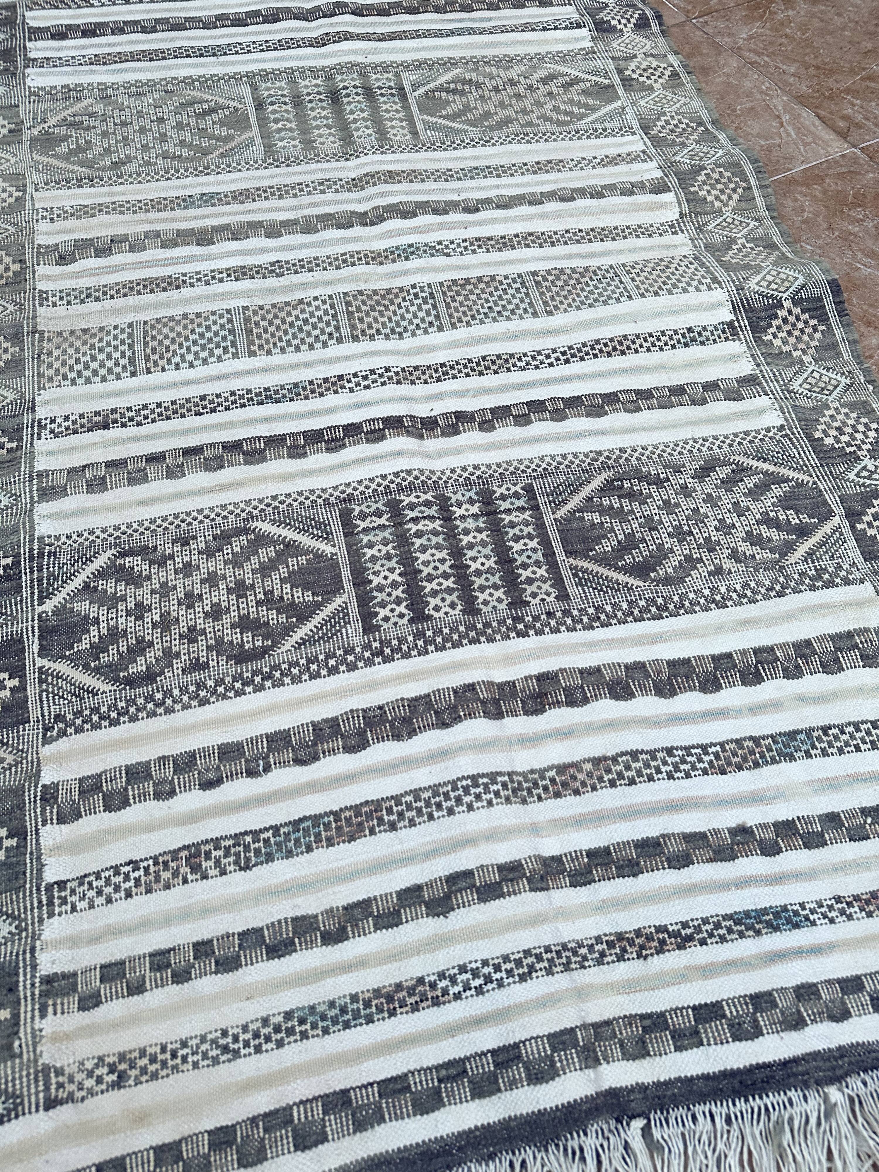 Handwoven Kilim rug made of camel wool, silk, and cactus.