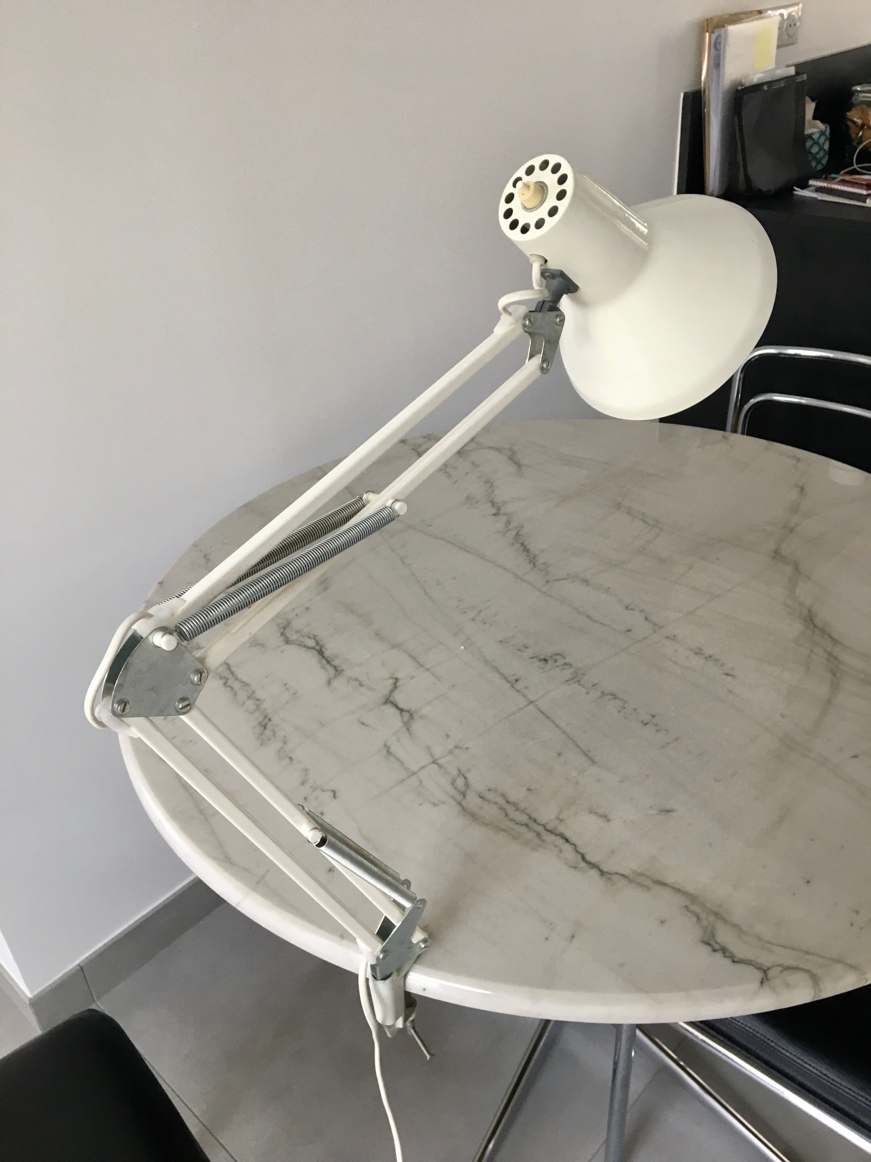 Off-white articulated architect lamp.