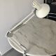Off-white articulated architect lamp.