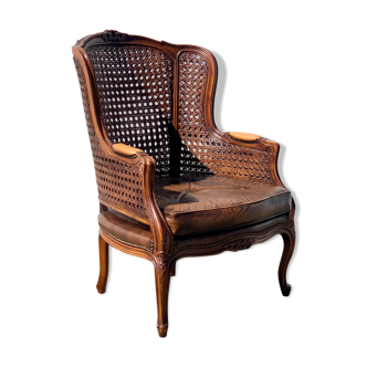 Fauteuil en rotin avec siège en cuir marron
