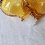 Zoomorphic carafe in amber glass