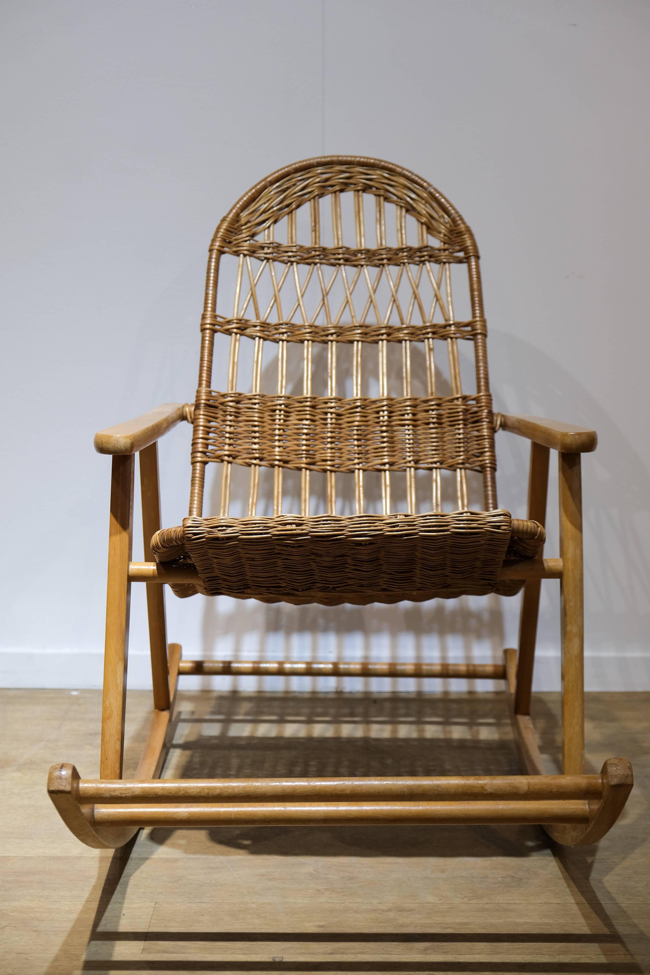 Wicker and wood rocking chair