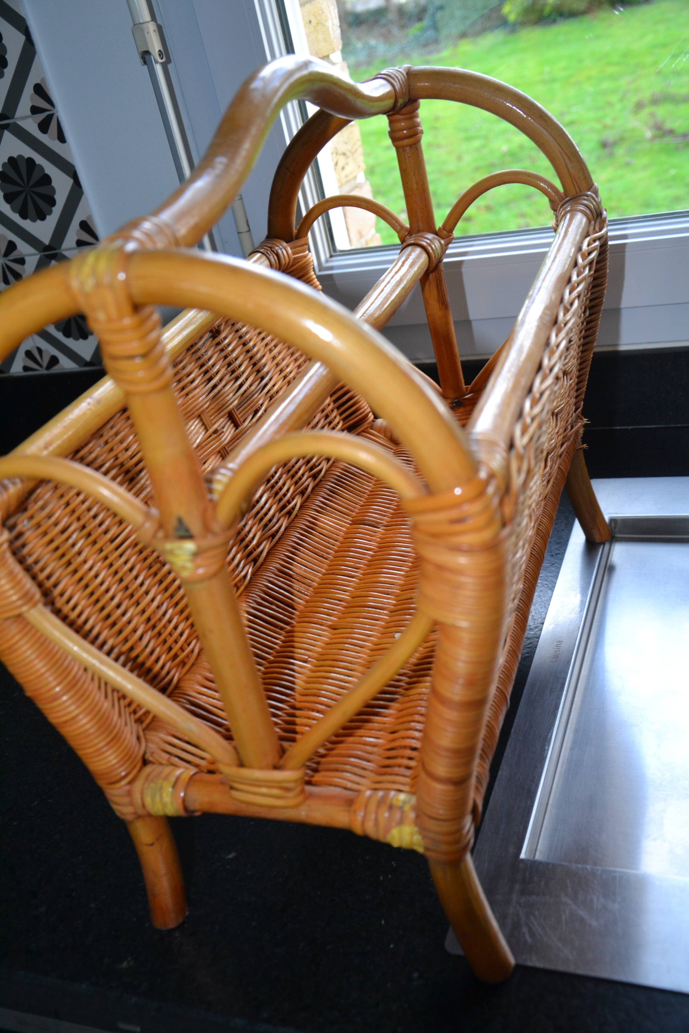 Vintage woven rattan magazine rack