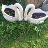 Swan-shaped garden vases in reconstituted stone
