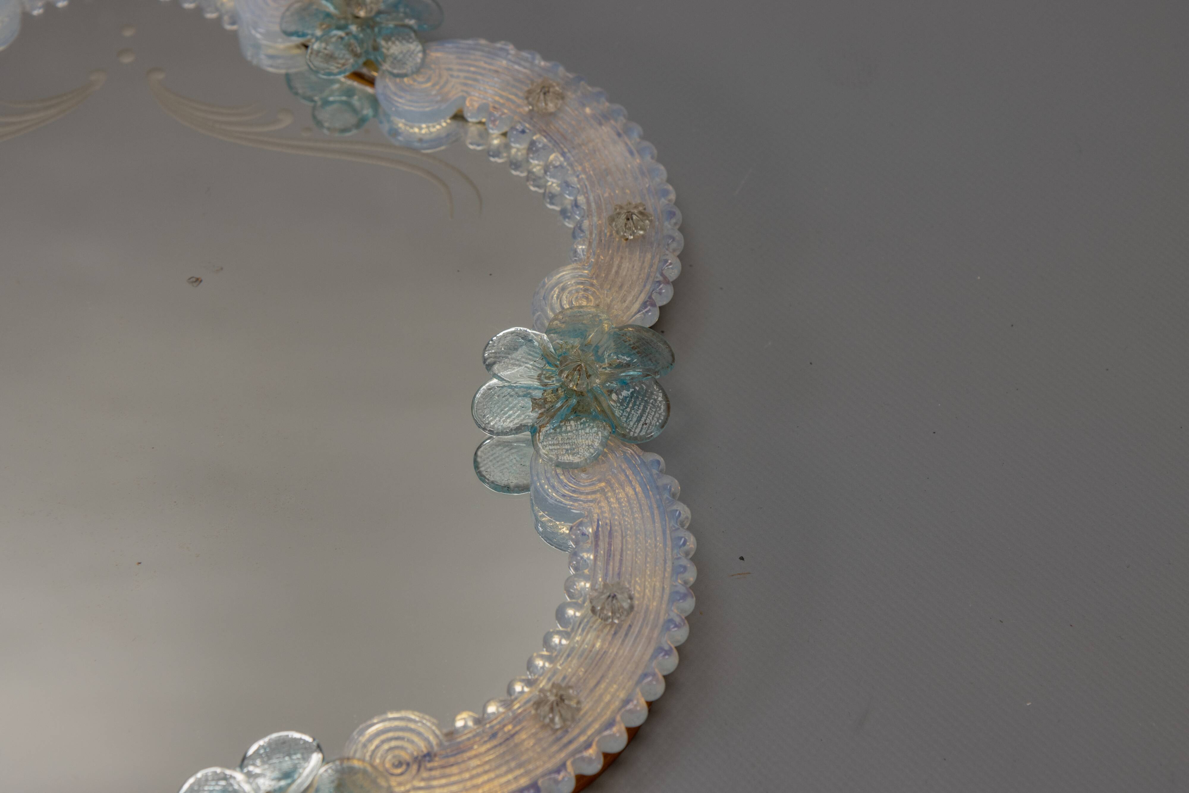 Italian Venetian Murano light blue and opalescent glass wall mirror, 1950s