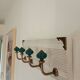 Wall-mounted coat rack in bleached wood and emerald green ceramic hooks –
