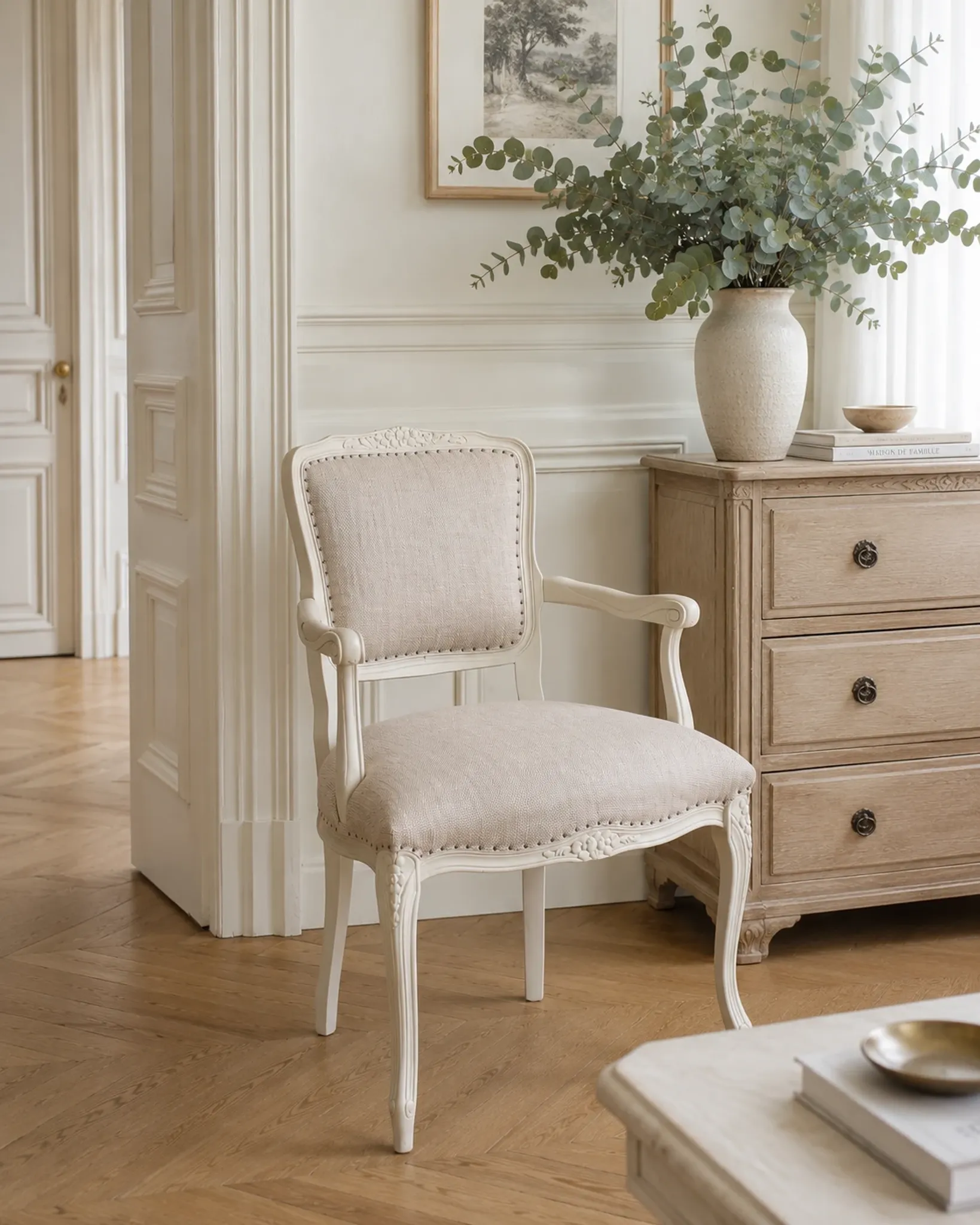 Louis XV style armchair, delicately patinated in a soft beige hue.