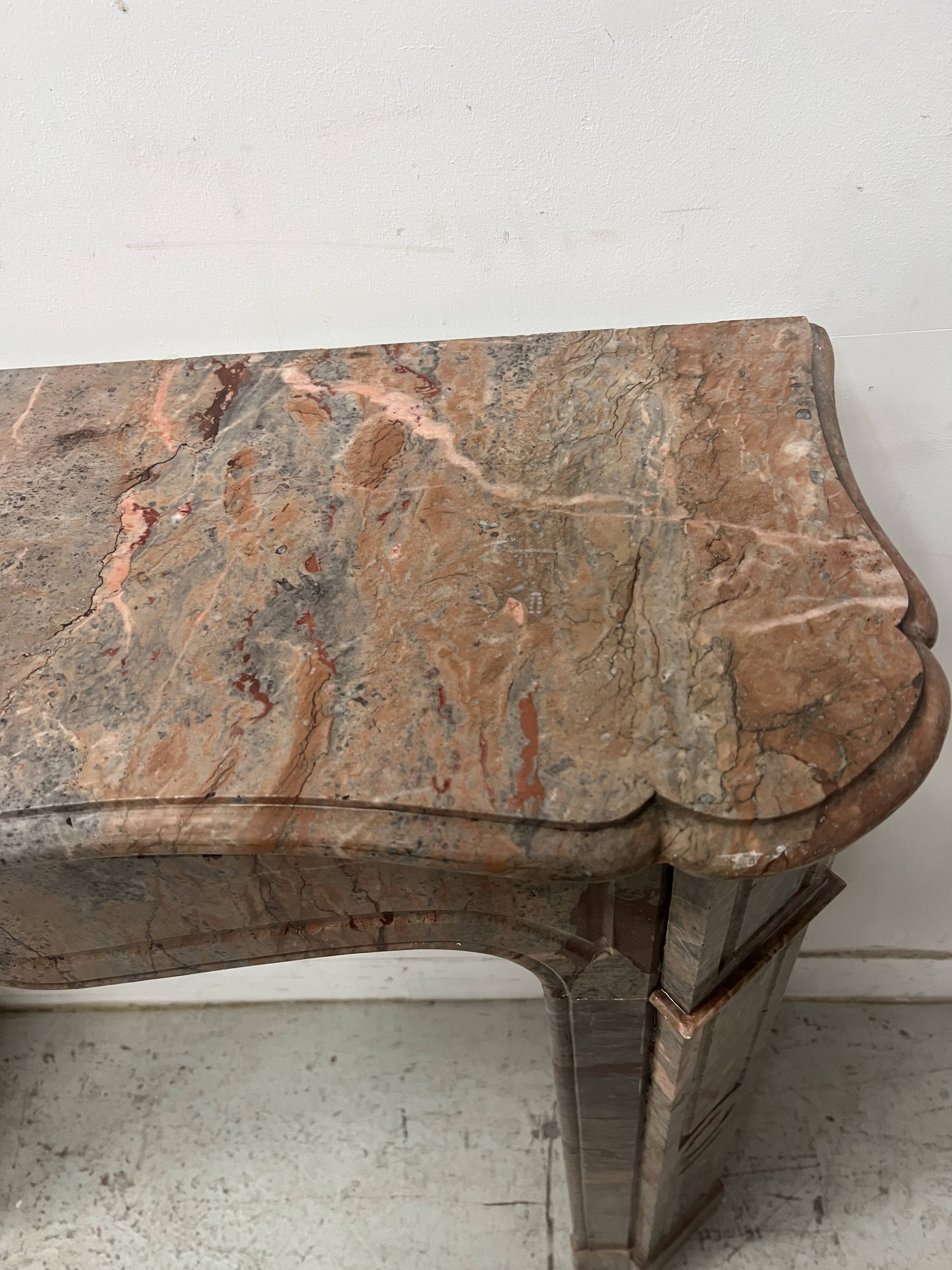 Louis XV style fireplace, "Pompadour" model, grey-pink marble, 20th century