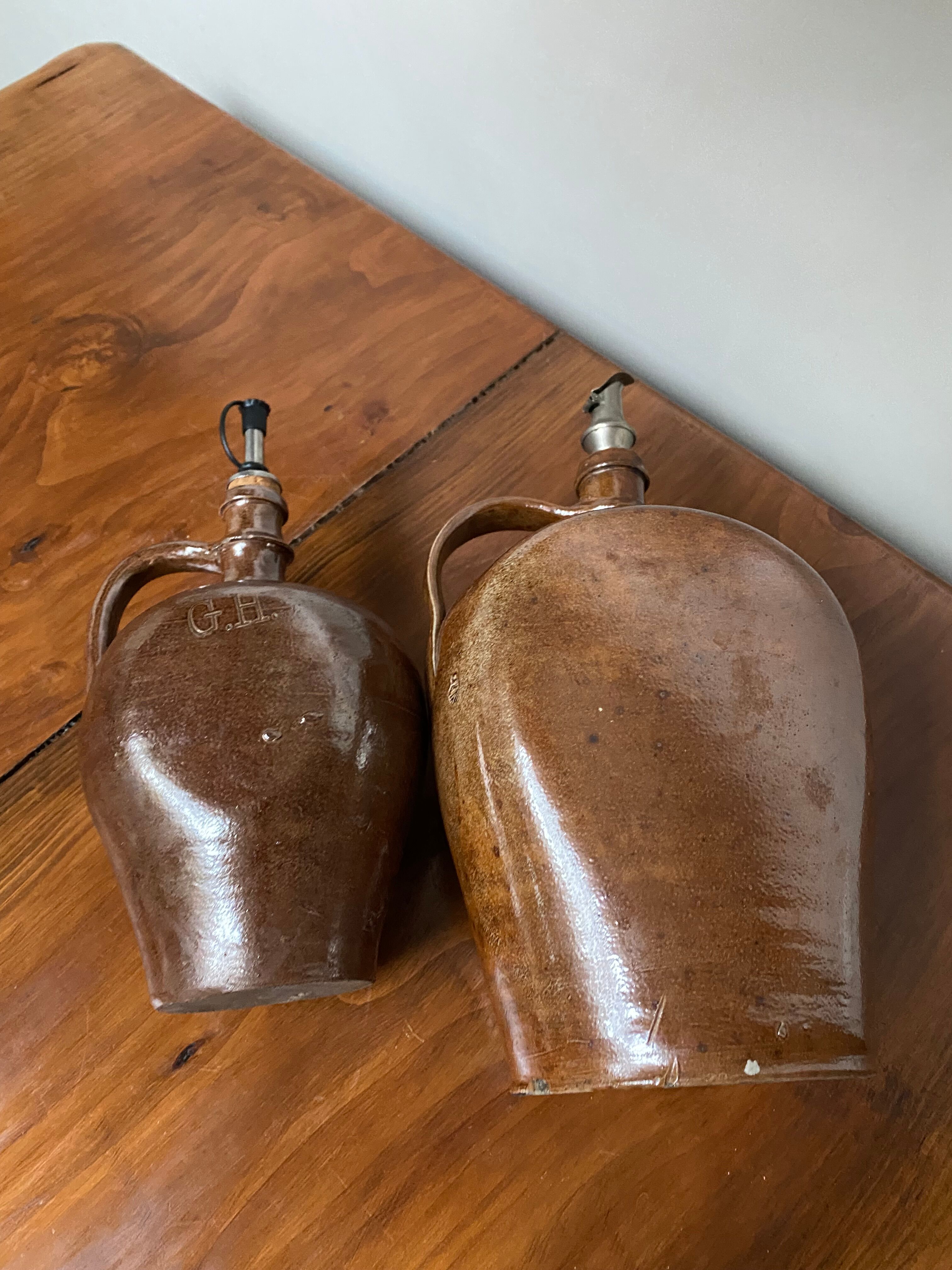 Pair of bottles in sandstone