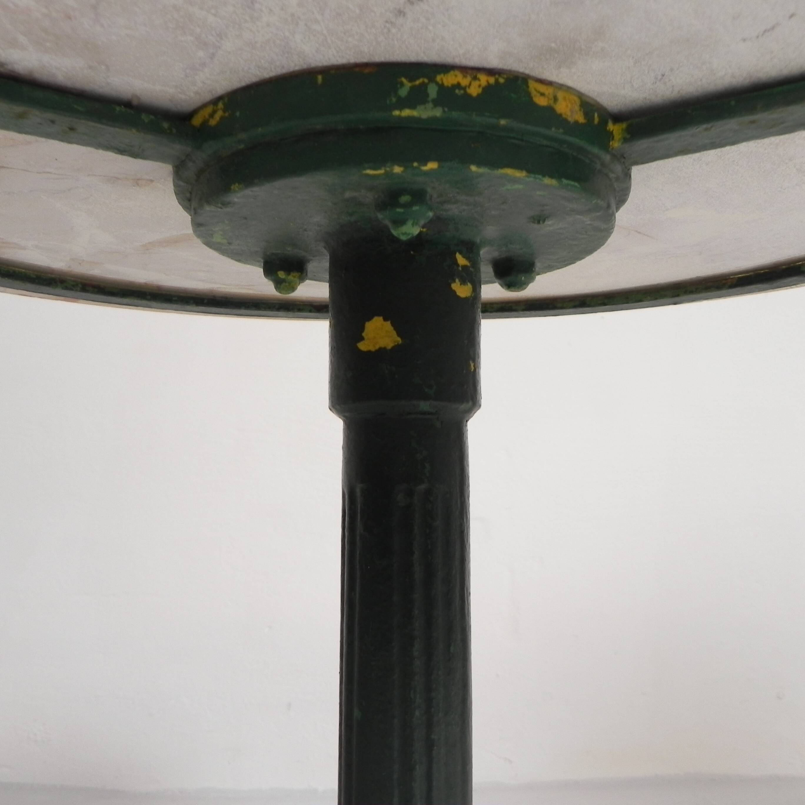 Bistro table with cast iron legs and marble top, 1920s.