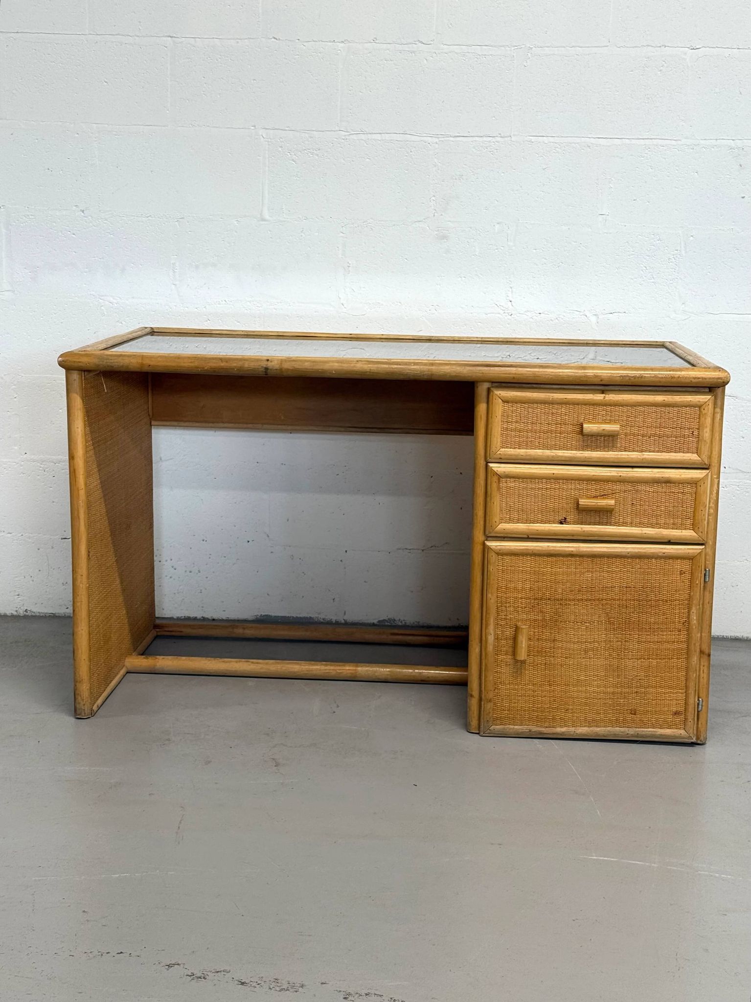 Vintage bamboo and woven rattan desk — glass top