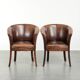 Ensemble de deux fauteuils en peau de mouton / fauteuils tubulaires avec une belle patine.