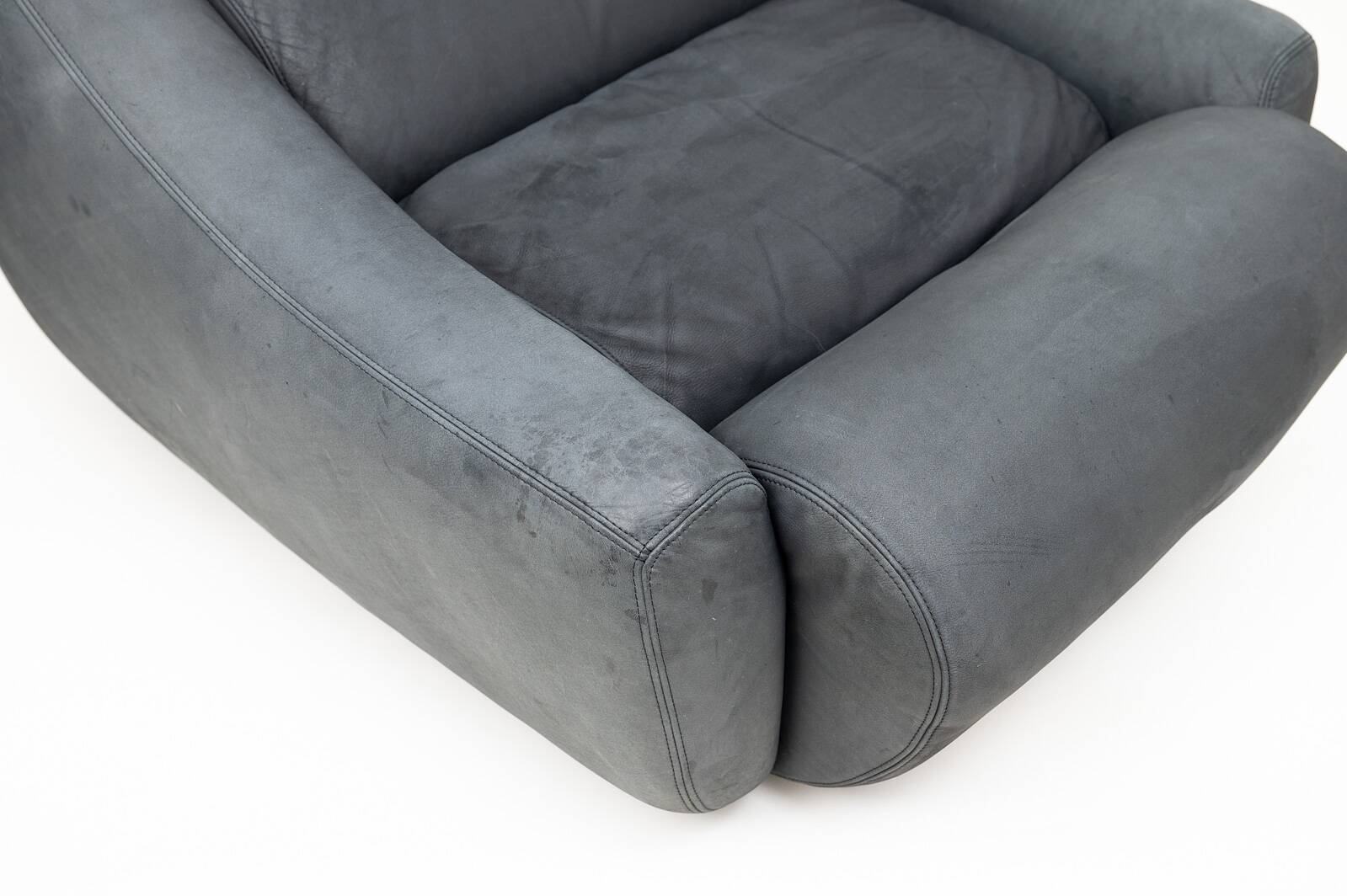 Large lounge chair and ottoman in leather, 1970