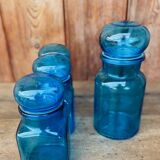 Set of 4 vintage blue glass jars.
