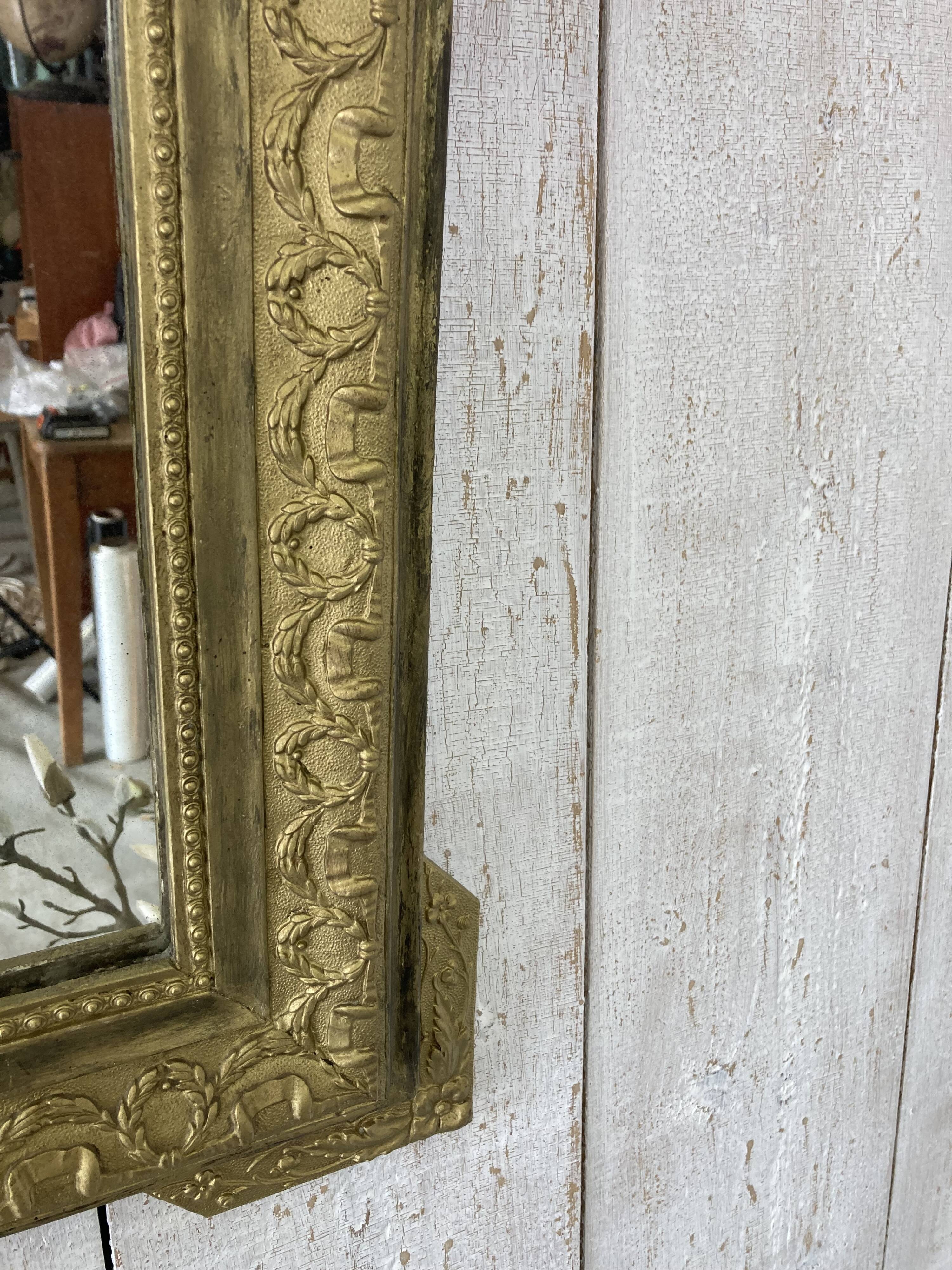 Antique mirror with a pediment