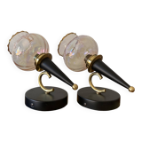 Pair of torch wall lights with iridescent pink glass shades and gold trim.