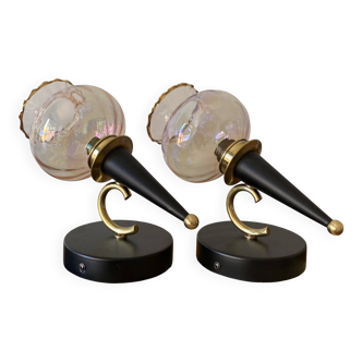 Pair of torch wall lights with iridescent pink glass shades and gold trim.