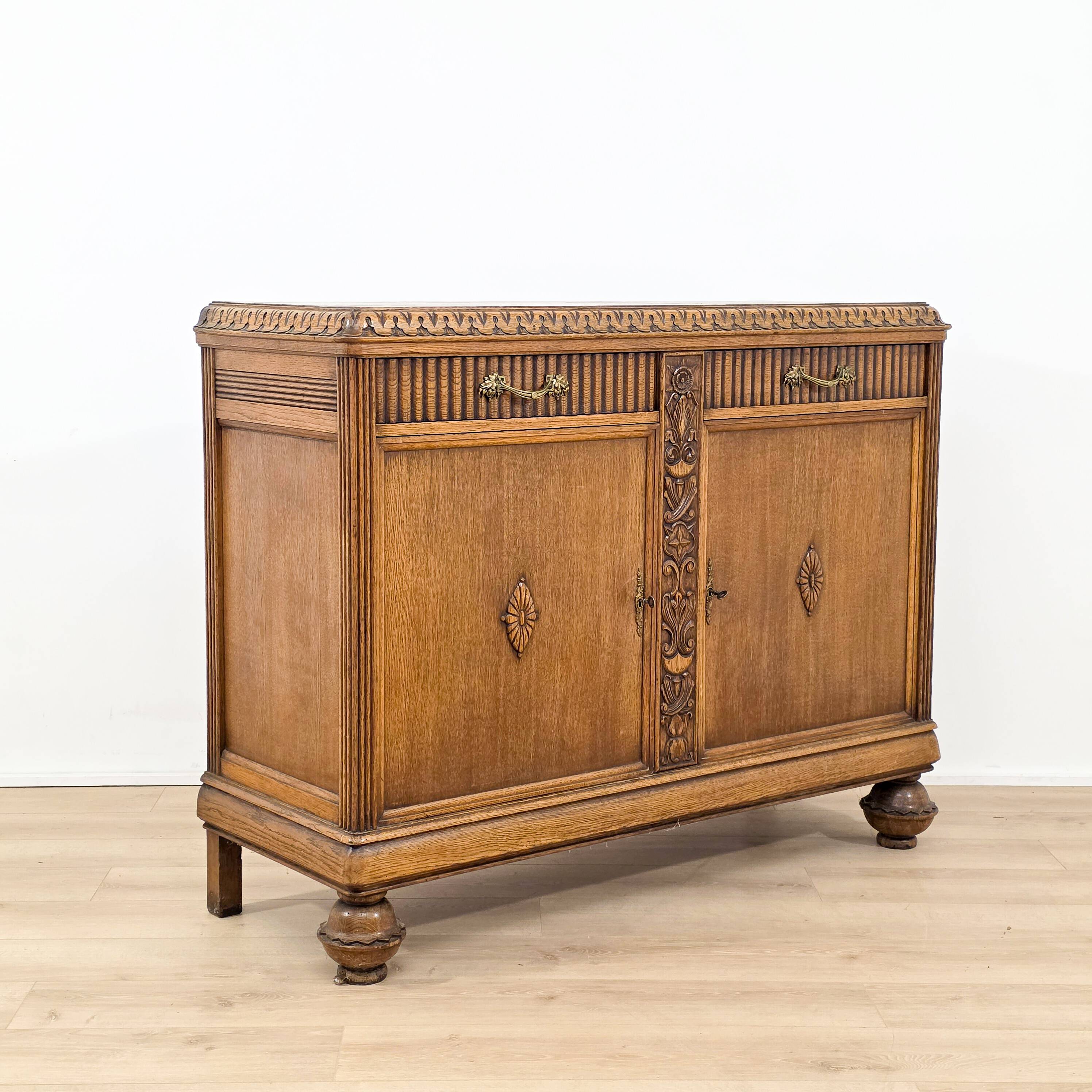 Elegant carved oak sideboard in Renaissance style from the 1930s