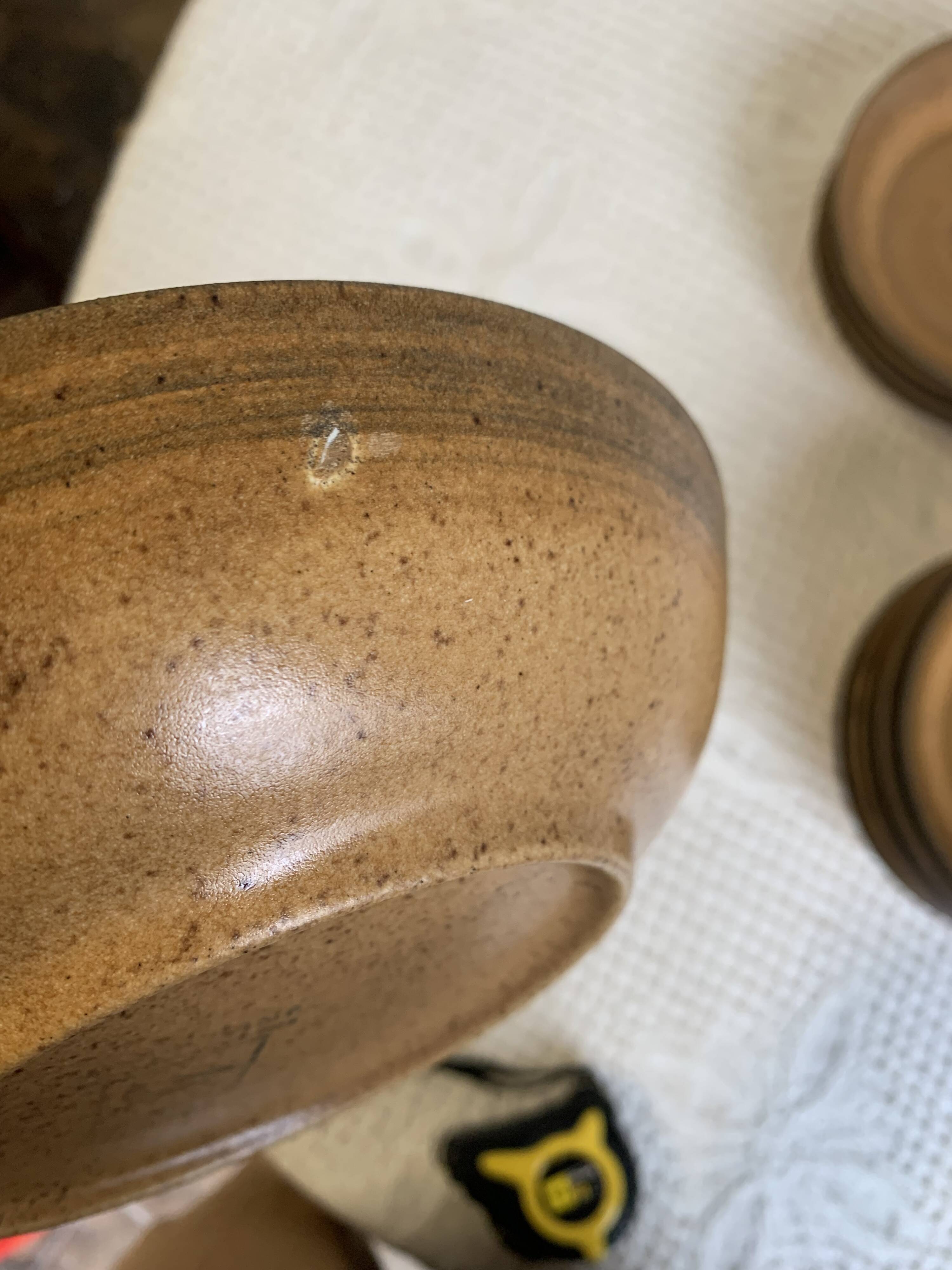 6 Longchamp brown enameled stoneware soup plates, 1970s