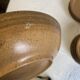 6 Longchamp brown enameled stoneware soup plates, 1970s