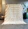 New white Moroccan Berber rug Beni Ouarain in wool.