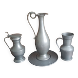 2 pitchers and 1 pewter pitcher
