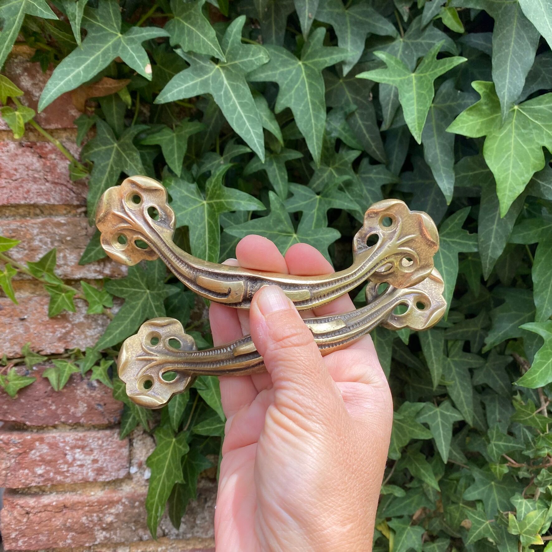 Pair of antique Art Nouveau brass handles