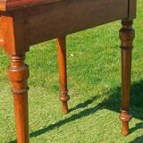 Antique solid wood table with a through drawer.