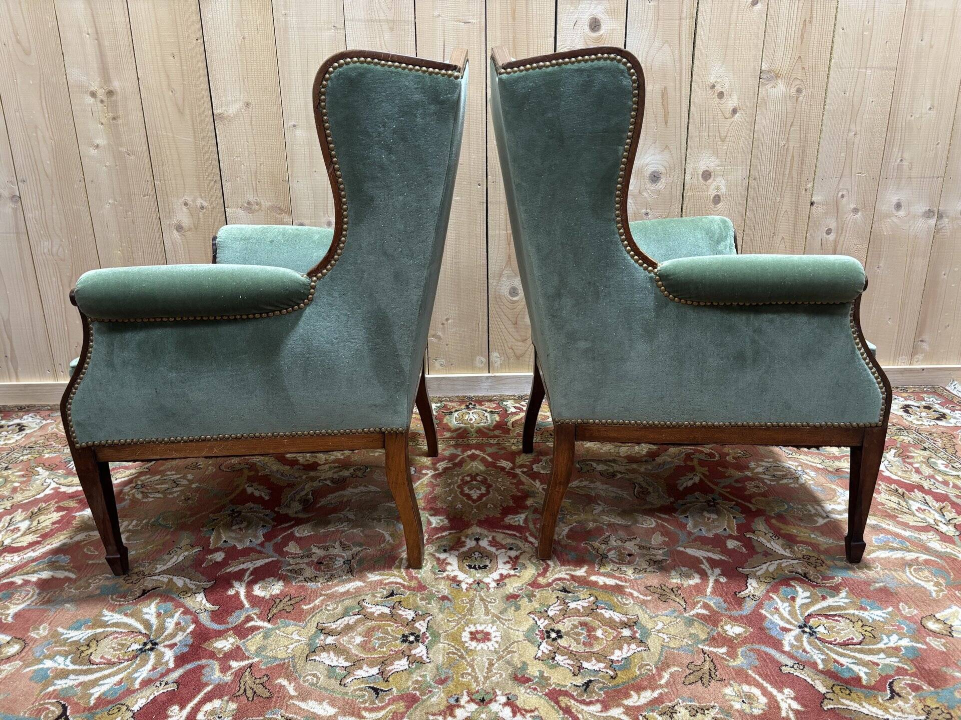 Pair of Louis XVI style wingback armchairs