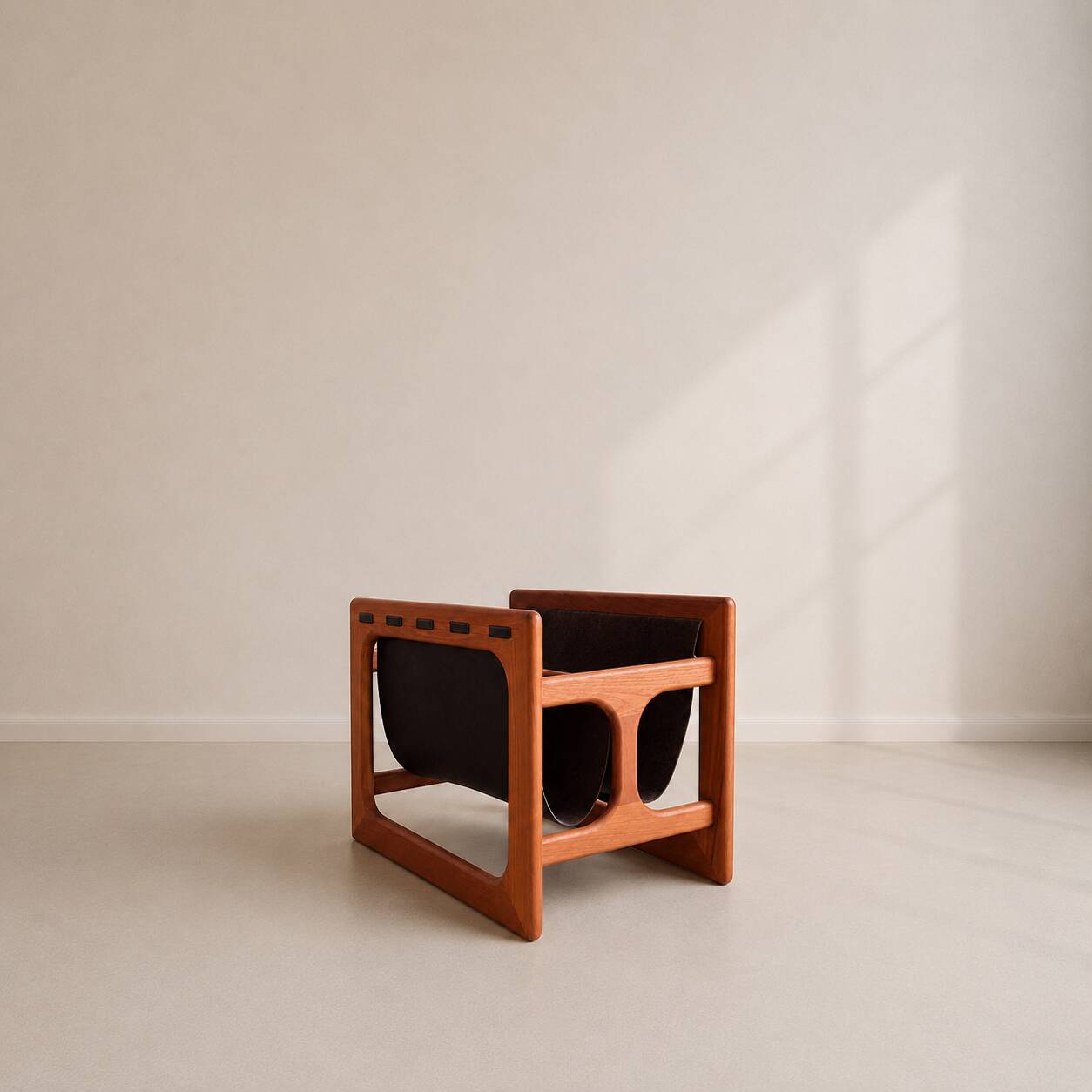 Teak and suede magazine rack by Aksel Kjersgaard for Salin møbler.