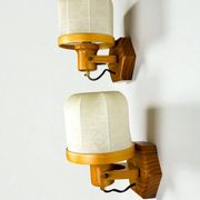 Pair of articulated "Cocoon" wall lights, resin and pine, Italy, circa 1970