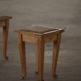 A pair of antique Danish pine stools from the late 19th century.