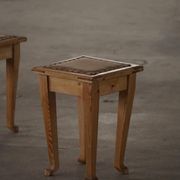 A pair of antique Danish pine stools from the late 19th century.