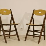 Pair of vintage folding chairs year 50 sculpted backrest.