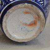 White hand-painted ceramic vase with blue patterns