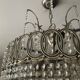 Cascading chandelier with crystal and silvered bronze pendants
